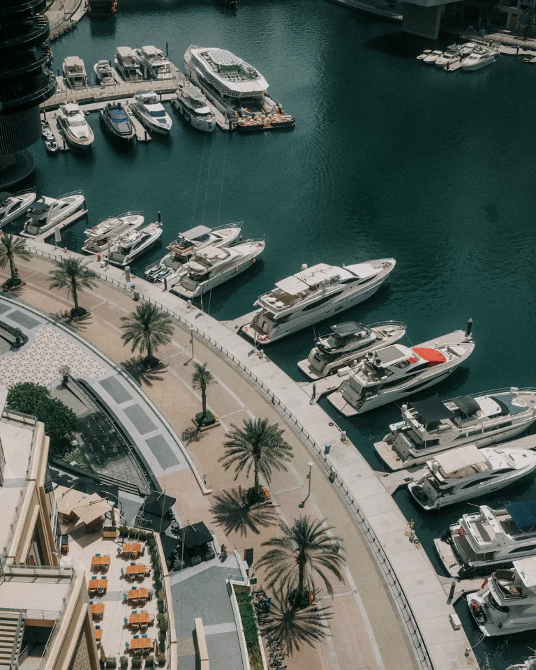 Yachts in Dubai Marina below residential towers