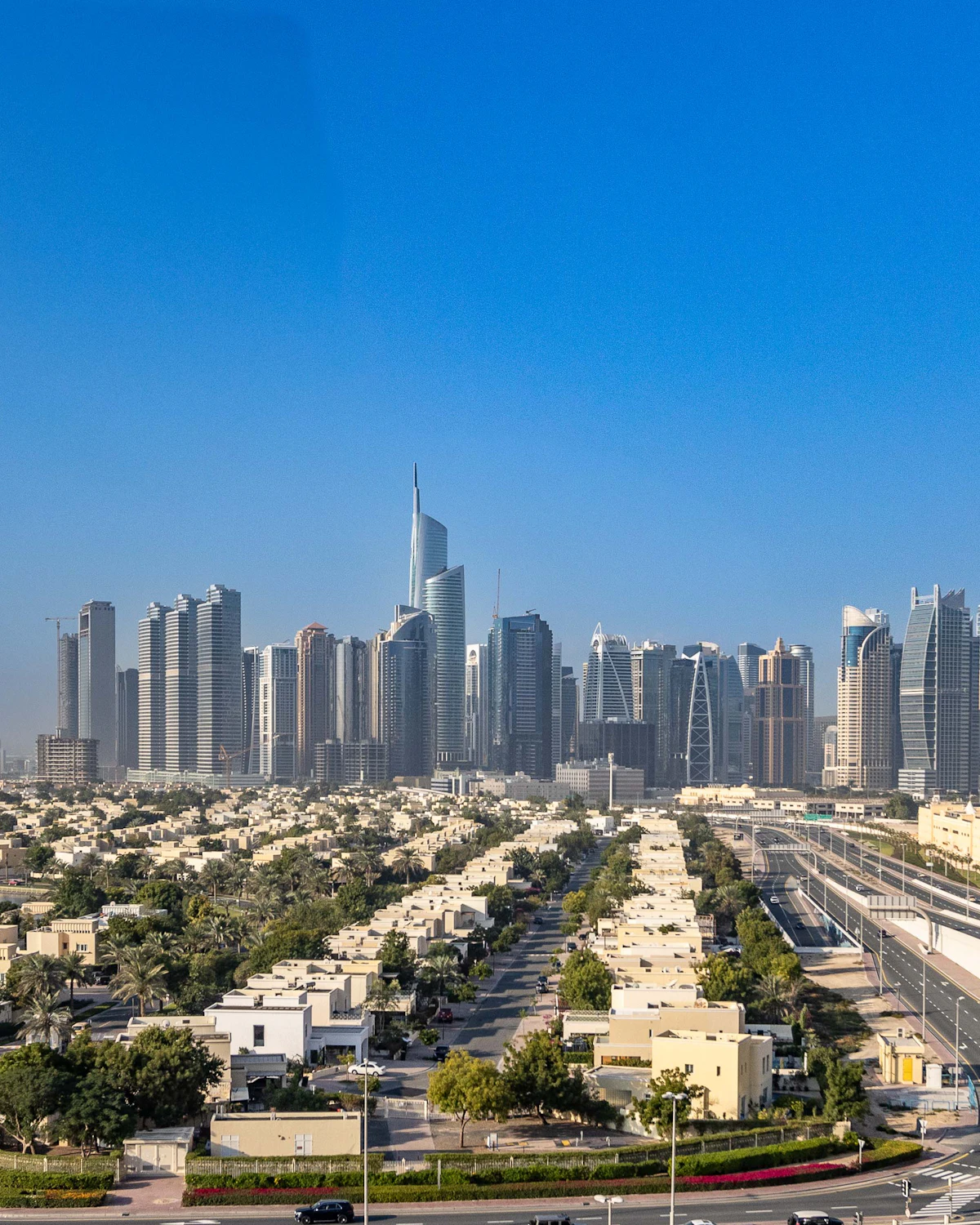 Villa community with high-rise towers behind, Dubai