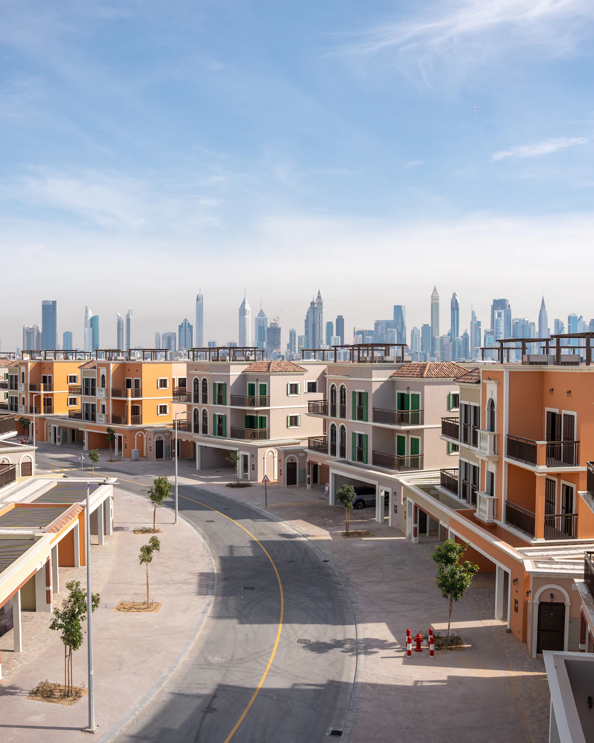 Colourful townhouses with the Dubai skyline behind
